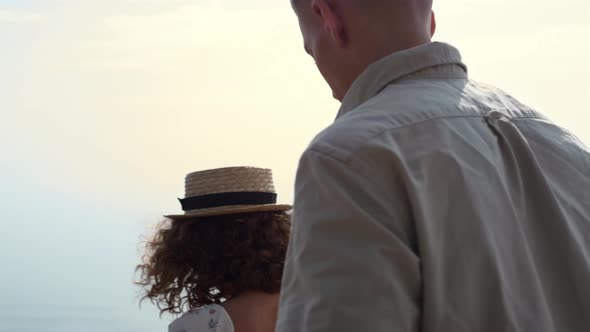 Happy Couple Going Down Stairs to Beach