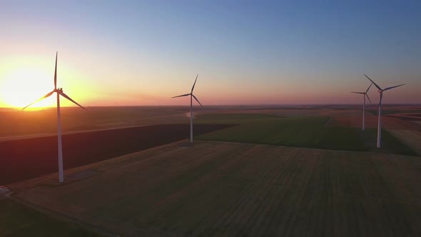 Wind Turbines in field at Sunset