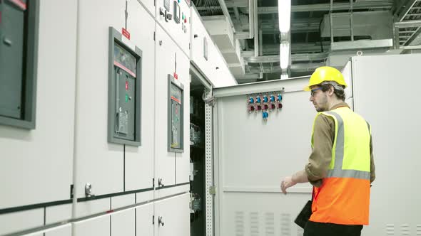 Electrical and Instrument technician checking electrical control board