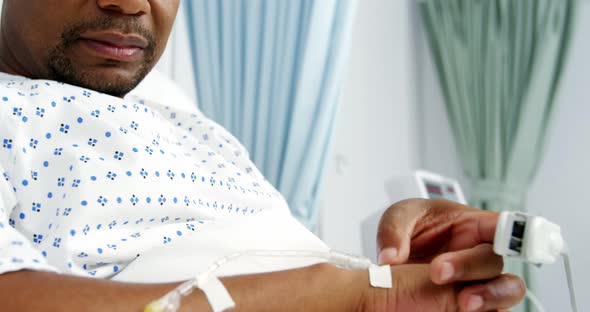 Male patient lying on bed