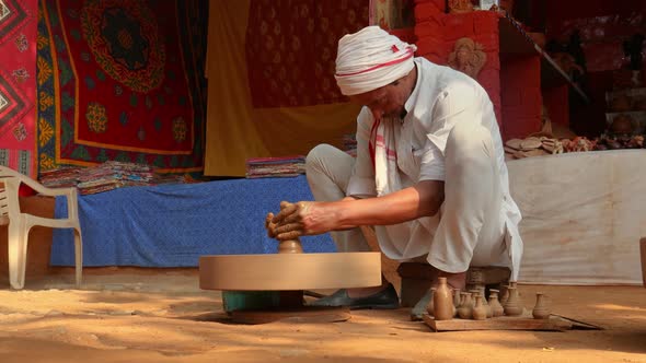 Potter at Work Makes Ceramic Dishes