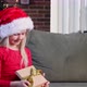 Small little child in red dress opening Christmas or New Year gift box present - VideoHive Item for Sale