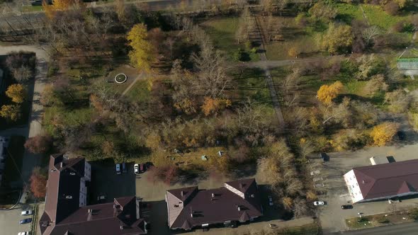 Aerial view of park next to three-story and five-story houses 52