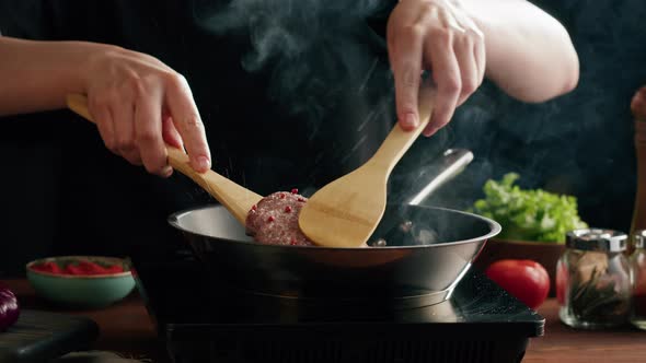 Frying Beef Cutlet in Pan Closeup