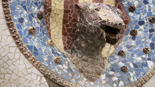 Gaudi ceramic Mosaic head in Park Guell. Barcelona. Spain