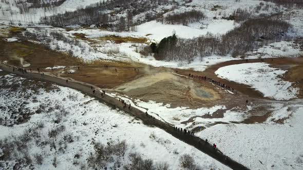 Aerial view of visitors in  Geysir Hot Spring Area in iceland.