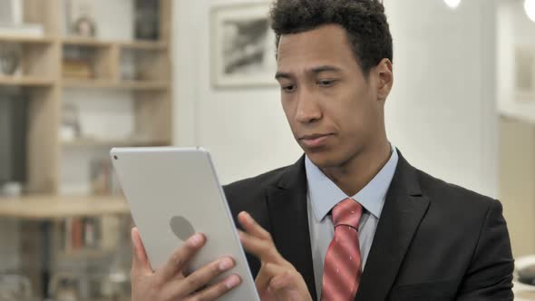 African Businessman Using Tablet