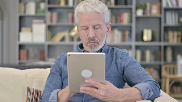 Old Man Using Tablet