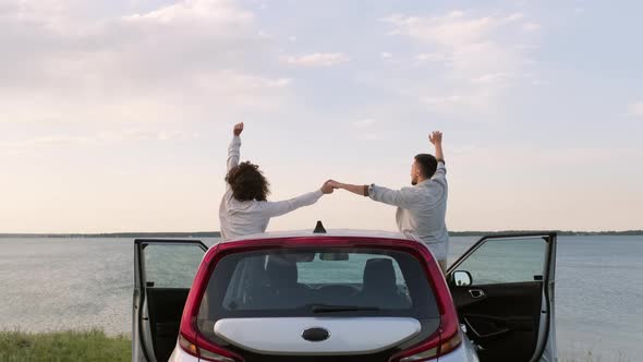 Young Couple Enjoying Summer Wind