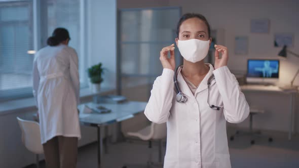 Physician Taking Mask Off