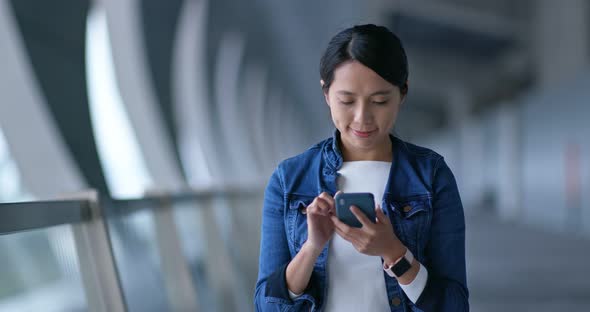 Woman look at mobile phone for searching