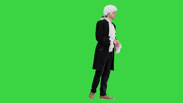 Man in 18Th Century Camisole and Wig Doing Welcoming Gesture on a Green Screen, Chroma Key.