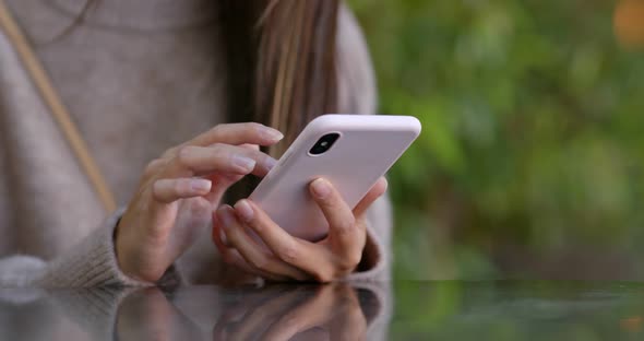 Close up of woman use of mobile phone at outdoor