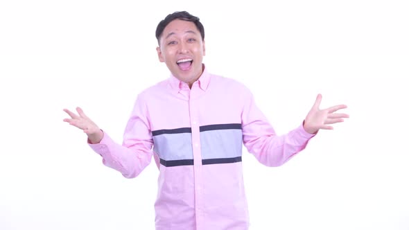 Happy Japanese Businessman with Surprise Gesture