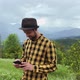 Man holding smart phone in landscape - VideoHive Item for Sale