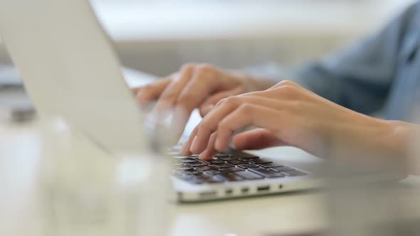 Close Up of Hand of African Woman Typing on Laptop