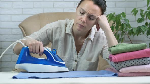 Tired woman with an iron.