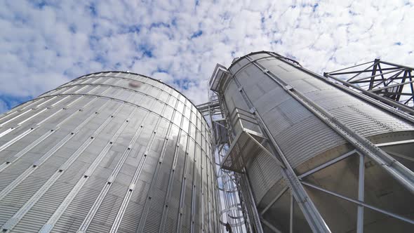 Grain elevator for storage of agricultural crops. Modern silos. Close-up.