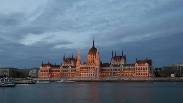 Evening time lapse from cruise ships and ferries with the Hungarian Parliament Building