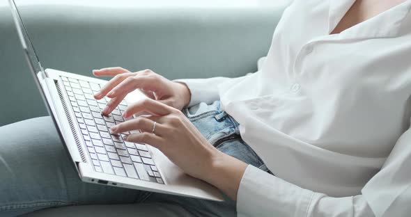 Close Up Female Hands Using Keyboard Writing Emails Using Internet