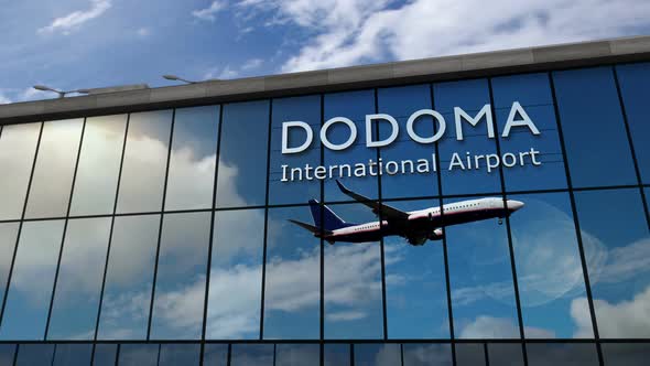 Airplane landing at Dodoma Tanzania airport mirrored in terminal alt
