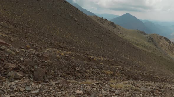 Glacier corridor excavated into the rocky mountain ground in High Atlas, Morocco