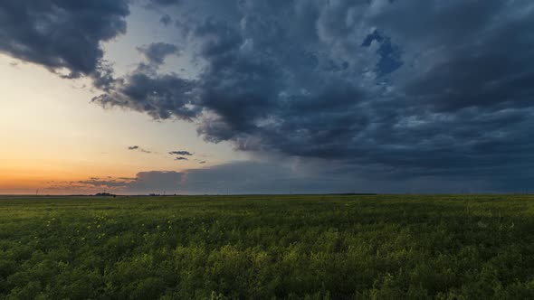 Storm Clouds Rolling Over Prairies at Sunset  Time Lapse