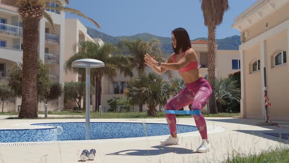 Sporty Woman Elastic Band Squat Exercises