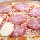 Woman Puts Sausage on Pizza Close Up - VideoHive Item for Sale