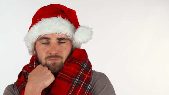 Young Man in Christmas Santa Hat Looking Upset