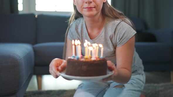 Woman Celebrating Birthday at Home Alone with Birthday Cake