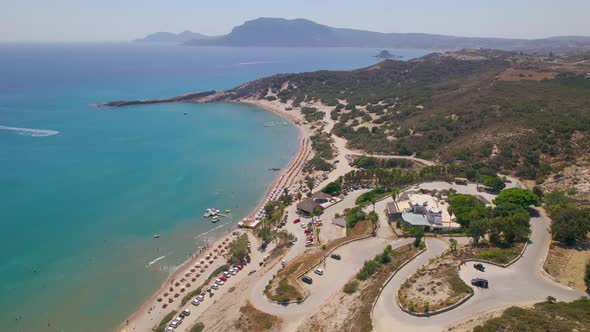 Aerial view approaching Paradise Beach from hills, Kos, Greece