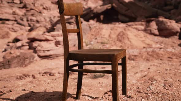 Old Wooden Chair on Rocks of Grand Canyon