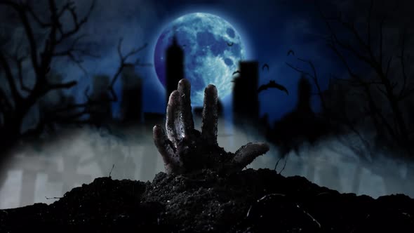 From the Grave Slowly Emerging Human Hand in the Background Cemetery and Moon, Smoky Background