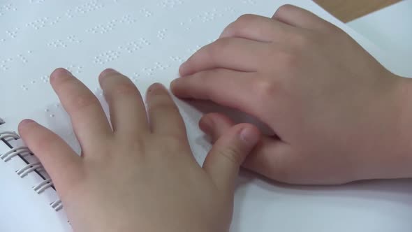 Little Boy Reading Braille
