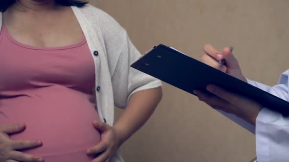 Pregnant Woman and Gynecologist Doctor at Hospital