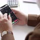 man is exploring a stock market on his phone - VideoHive Item for Sale