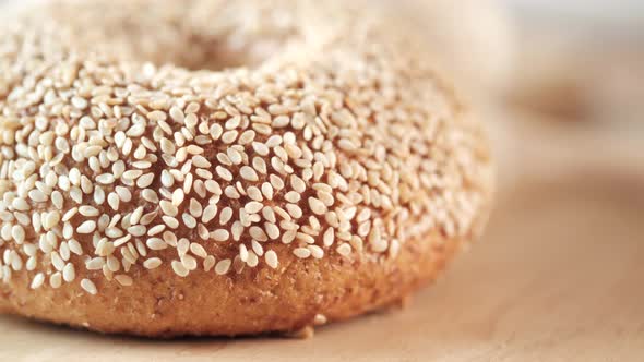 Fresh Bagel Bread in a Paper on Table