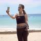 Ethnic Sportswoman Taking Selfie on Beach - VideoHive Item for Sale