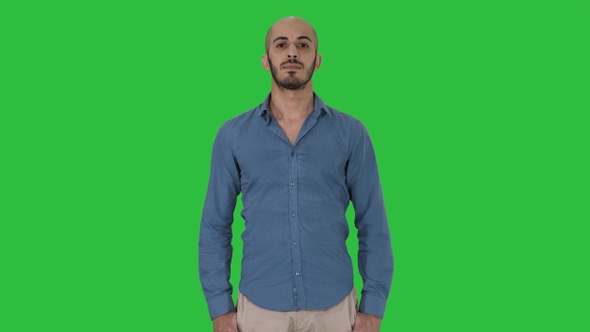 Strict Arabic Man Standing and Looking Into Camera on A