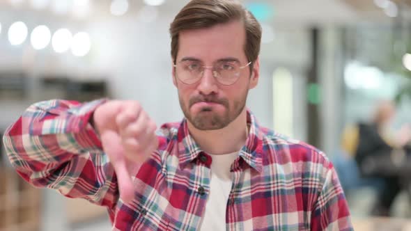 Disappointed Male Designer Doing Thumbs Down