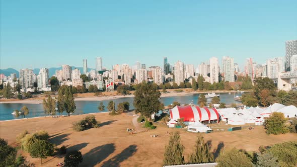 Downtown Vancouver, Pacific ocean, kitsilano beach, island, mountain, Canadian flag. (Drone footage)