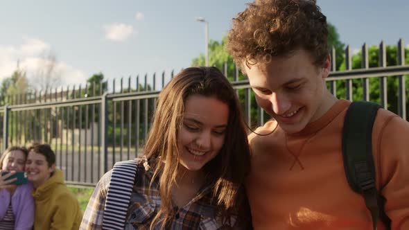 Teenagers hanging out in their school grounds