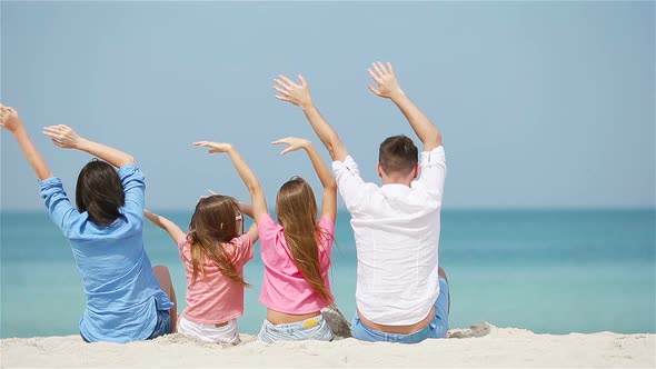 Young Family of Four on Beach Vacation