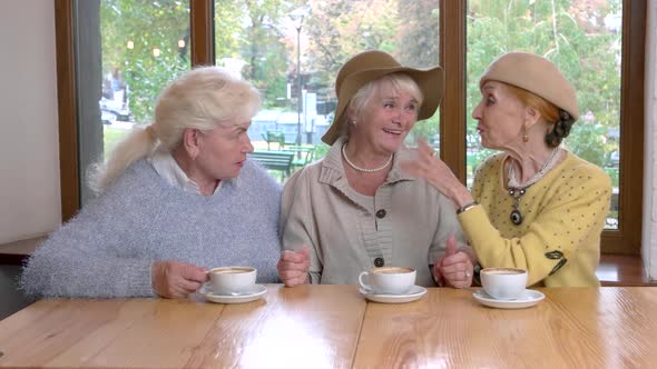 Three Senior Ladies at Table