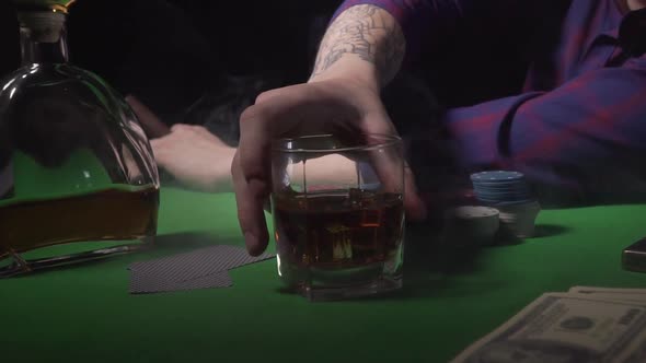 Guy Drinks Whiskey at the Casino