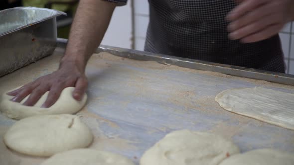 Man Preparing Turkish Traditional Ramadan Pita in the Bakery 4K