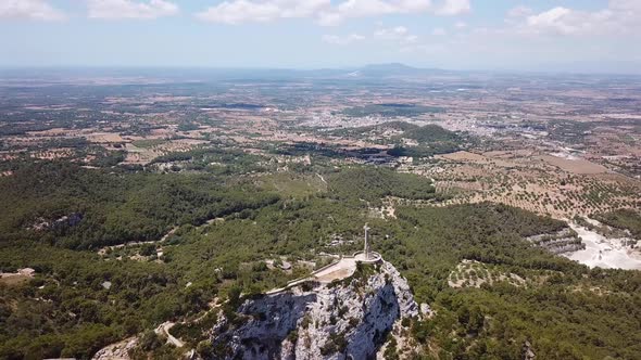 Aerial: The Holy Cross on the mountain of Saint Salvador in Mallorca, Spain