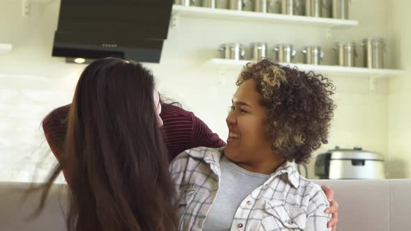 Girlfriend Asian Hugs Her AfricanAmerican Girlfriend From Behind