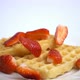 Sliced Strawberries Fall on Waffles - VideoHive Item for Sale